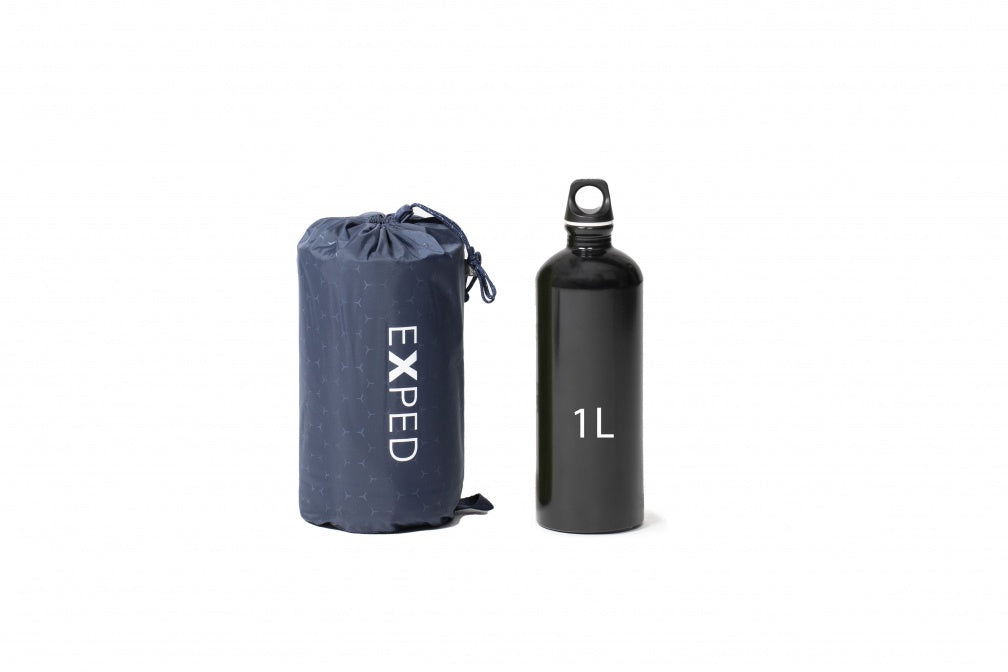 Size comparison: A packed Versa 2R mat in size medium is slightly wider than a 1-liter water bottle and a similar height