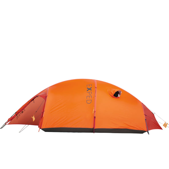 Side profile of the orange Exped Polaris tent, staked out with open vestibule